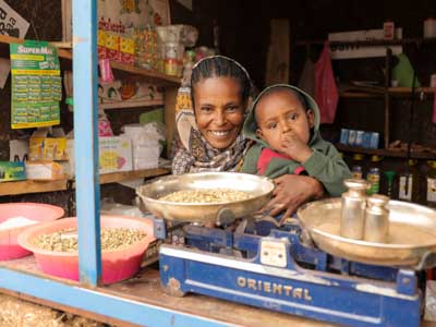 an Ethiopian woman with her boy in her shop