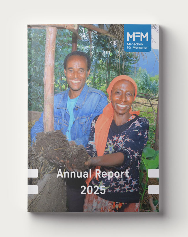Cover of the 2025 Annual Report featuring a man and a woman in their garden.